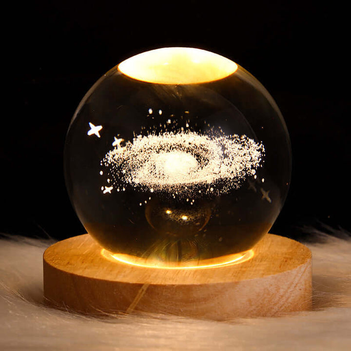 Luminous Starry Sky Crystal Ball Night Lamp with 3D planetary projection on wooden base, perfect for Japandi and Biophilic decor.