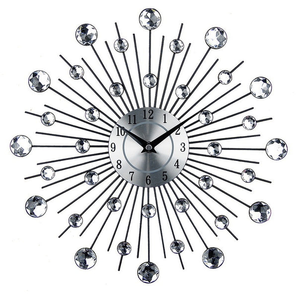 Modern wall clock with metallic sunburst design and crystal accents, perfect for contemporary living room decor.