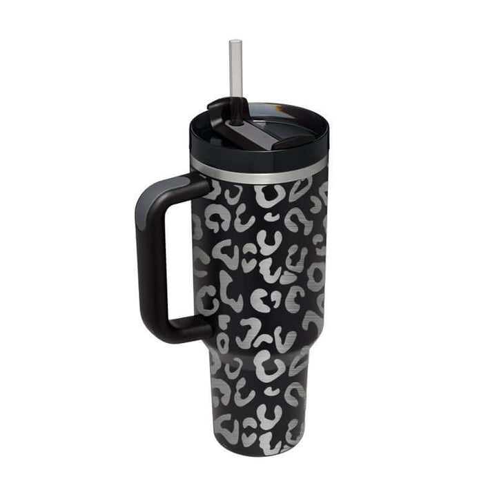 Stylish 40 Oz insulated stainless steel tumbler with handle and straw, featuring a leopard print design ideal for hot or cold drinks.