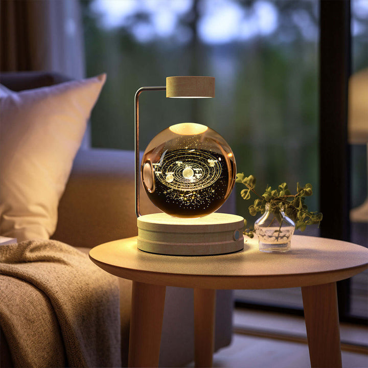 Crystal Ball Night Light with 3D Design on a wooden table beside a cozy sofa, perfect for Japandi style decor.