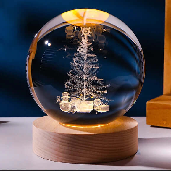 Luminous starry sky crystal ball with 3D planetary projections on a wooden base, perfect for cosmic room decor and ambiance.