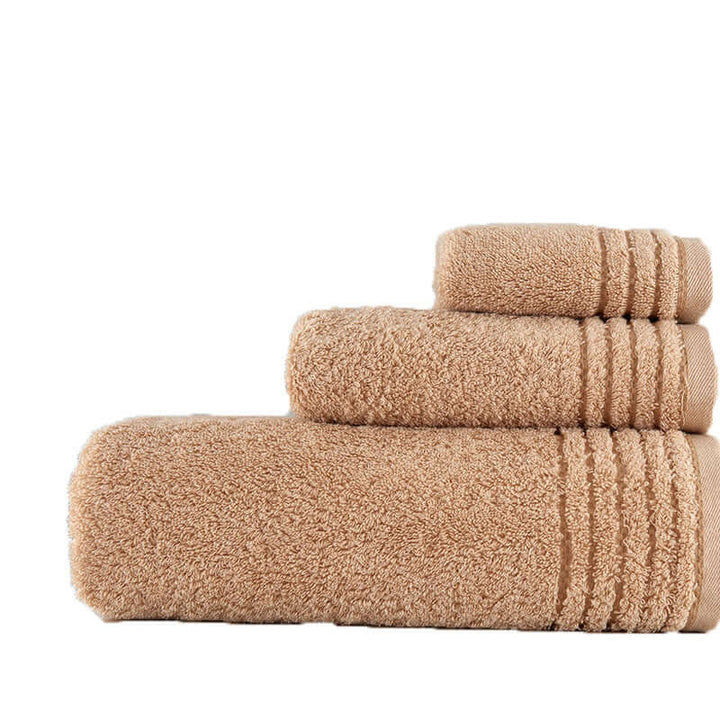 Soft cotton towel set in beige, luxurious and absorbent for home use, featuring sustainable materials and a cozy Japandi style.