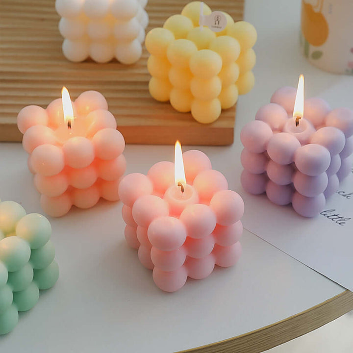 Geometric aromatherapy candles in pastel colors, inspired by biophilic design, perfect for modern minimalist decor and relaxation.