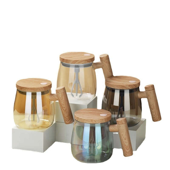 Four self-stirring coffee mugs with wooden lids and handles, placed on white blocks.