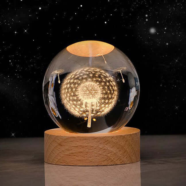 Luminous Starry Sky Crystal Ball Night Lamp projecting 3D cosmic designs on a wooden base, ideal for biophilic interior decor.