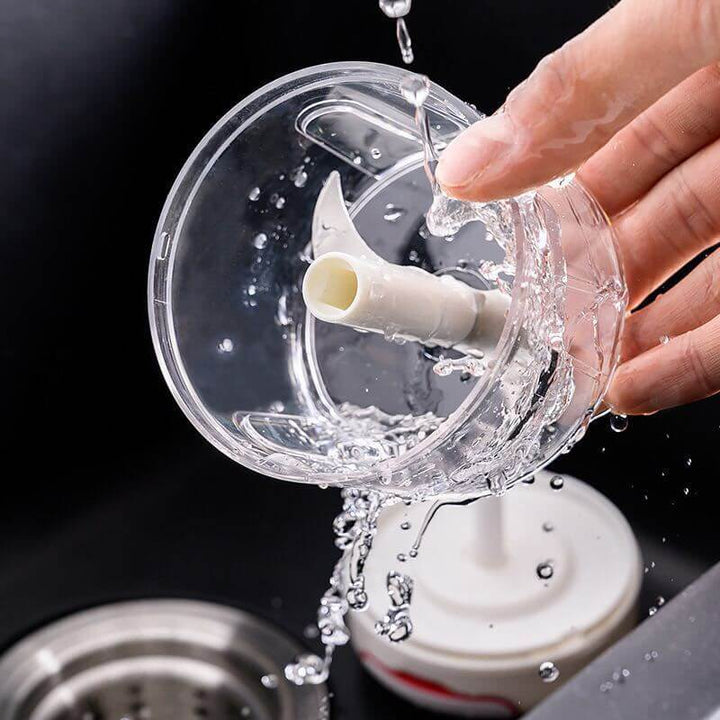 Cleaning Small Cut-and-Pull Garlic Press with water in sink