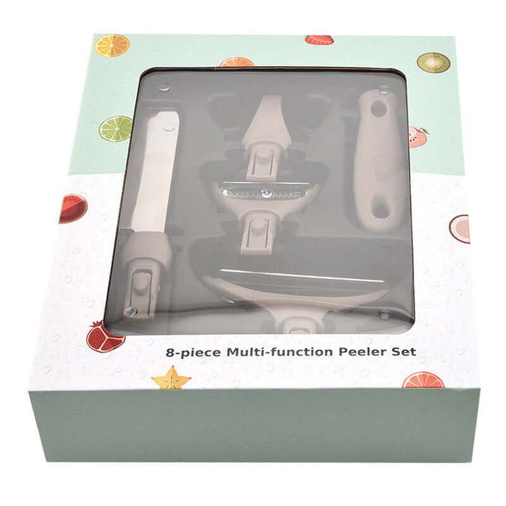 Multi-function peeler set in decorative box with citrus fruit designs, includes a chopping board, knife, and peeler.