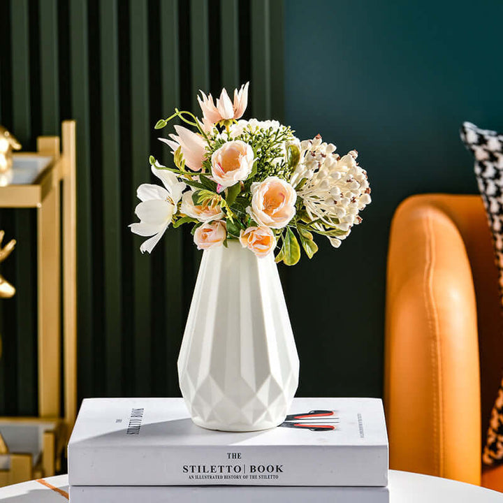 Nordic style color vase with floral arrangement on books, enhancing modern living space with stylish decor.