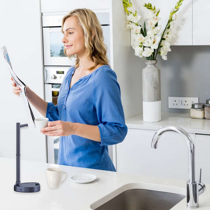 Woman in modern kitchen with an automatic water dispenser, surrounded by biophilic design elements and sustainable materials.