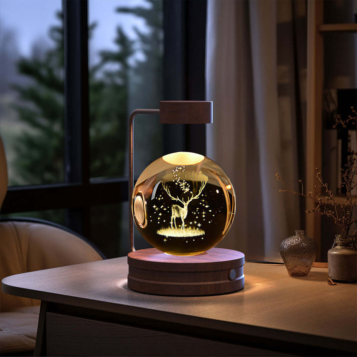 Crystal Ball Night Light with 3D pattern on a wooden desk, creating a cozy ambiance in a modern living room setting.