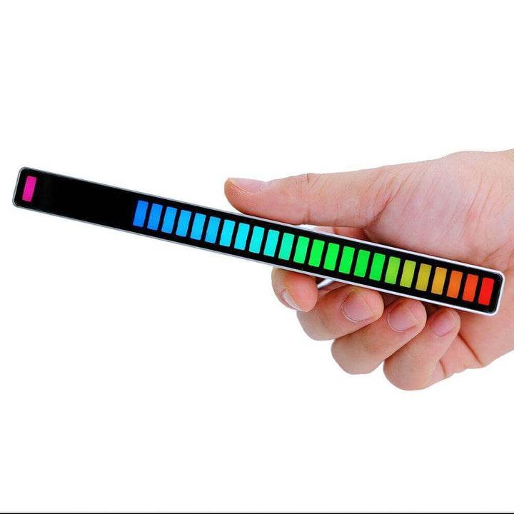 Hand holding spiral RGB rhythm light bar with colorful display, ideal for parties and ambient decor.