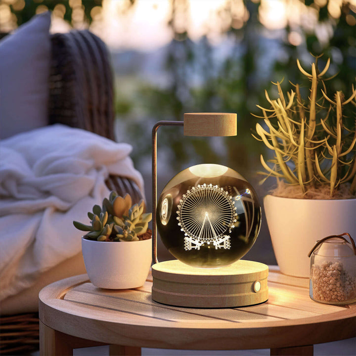 Crystal Ball Night Light on table, USB-powered 3D lamp with warm glow, featuring biophilic design and sustainable elements in cozy setting.