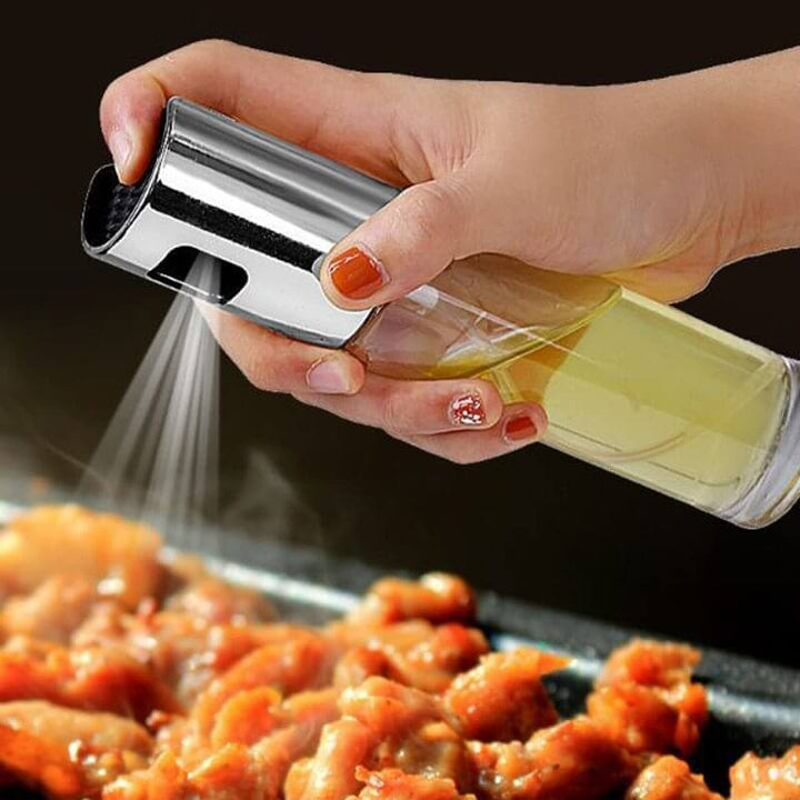 Using BBQ oil and vinegar spray bottle for grilling chicken