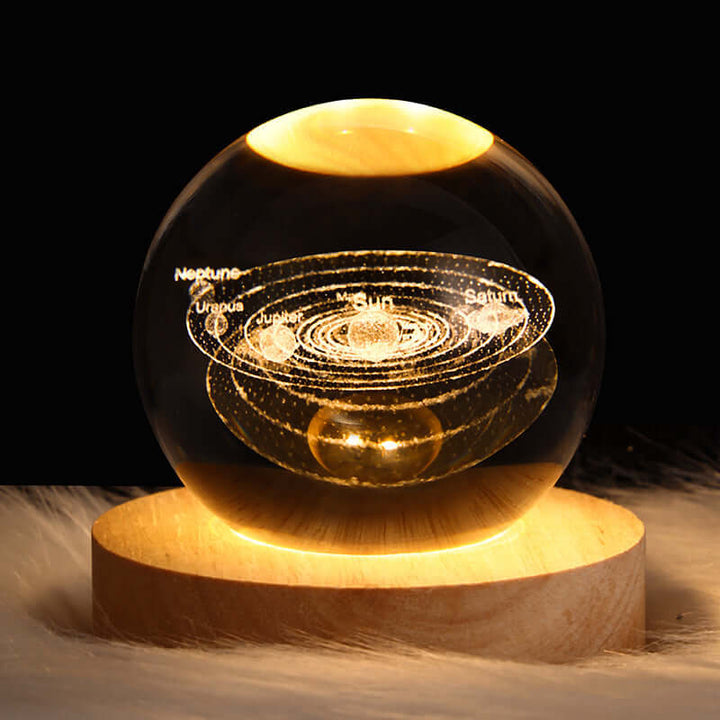 Luminous Starry Sky Crystal Ball Night Lamp with 3D Planetary Projections on wooden base, perfect for cosmic-themed decor.