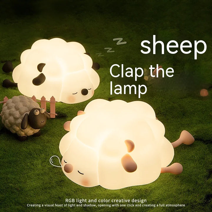 Cute sheep silicone night light glowing on grass, designed for kids, rechargeable and dimmable with a soft, comforting glow.