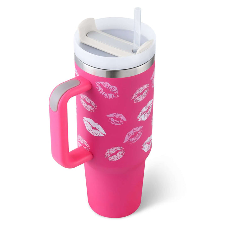 Pink 40 Oz insulated tumbler with handle and straw, featuring a kiss print design. Ideal for hot coffee or iced drinks, spill-proof lid.