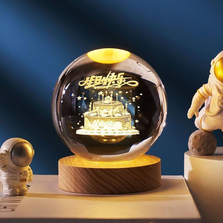 Luminous Starry Sky Crystal Ball Night Lamp with 3D planetary projections and astronaut figurines on a wooden base.