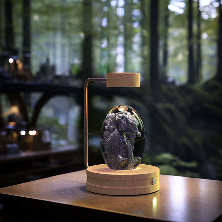 Crystal Ball Night Light with 3D Dinosaur Design on a wooden table, creating a warm and cozy ambiance.