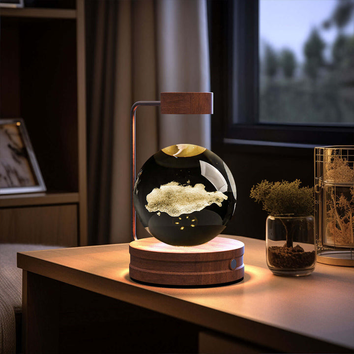 Crystal Ball Night Light with 3D design on a bedside table, perfect for creating cozy atmospheres and using sustainable materials.