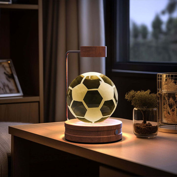 USB-powered 3D crystal ball night light emitting warm glow on bedside table with cozy decor elements in bedroom.