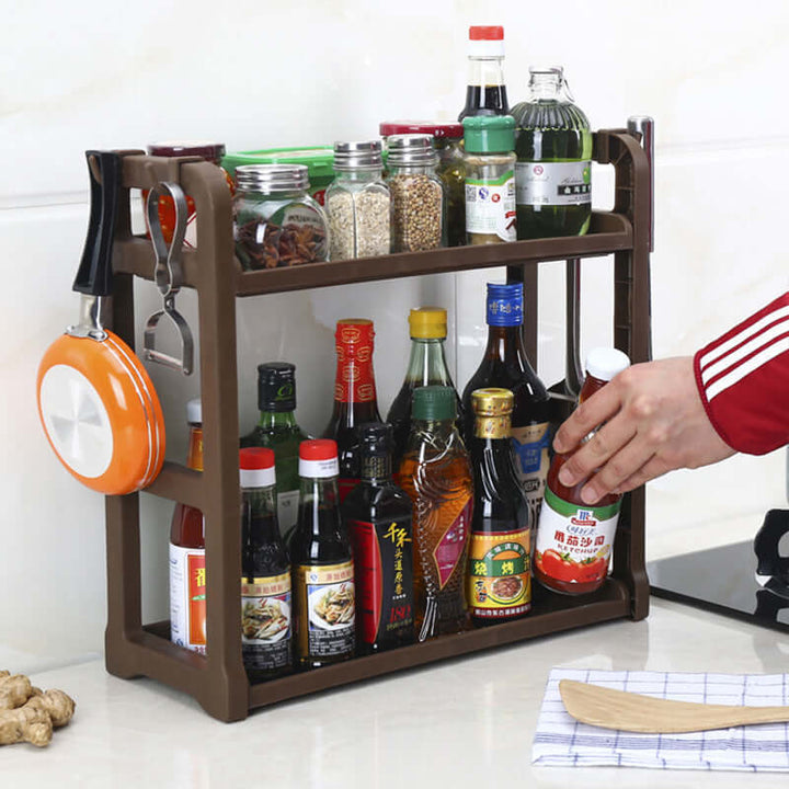 Multilayer kitchen storage shelving holding spices and sauces, enhancing space-saving organization and modern kitchen efficiency.