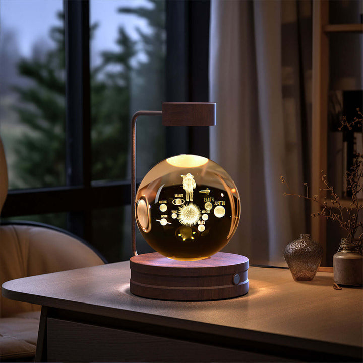 Crystal Ball Night Light with 3D dinosaur pattern on wooden table, ambiance lighting for cozy spaces and gift ideas.