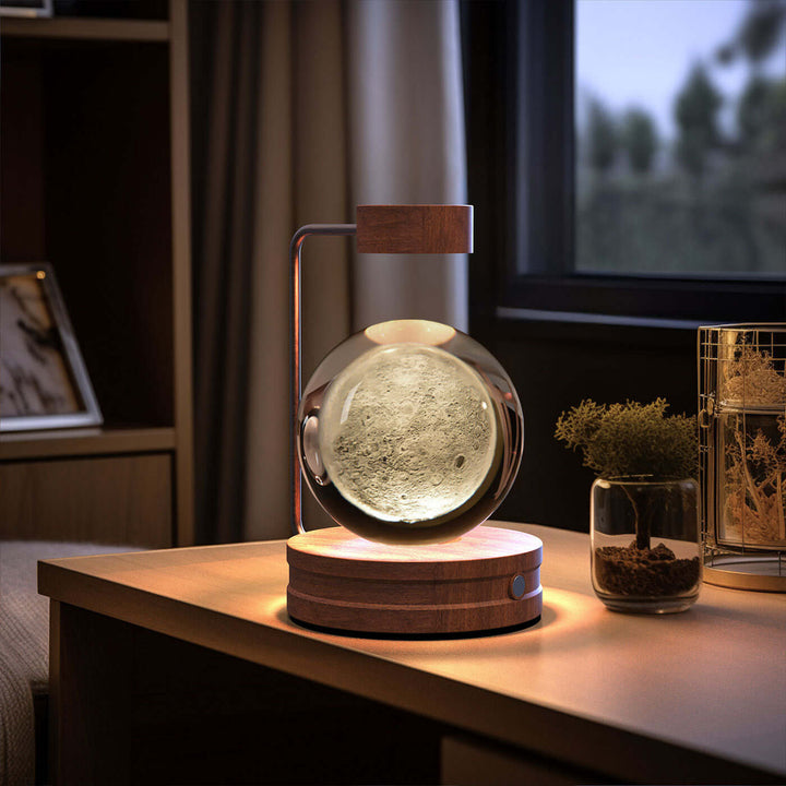 Crystal Ball Night Light on bedside table with warm LED lighting and 3D design, enhancing cozy and romantic bedroom ambiance.