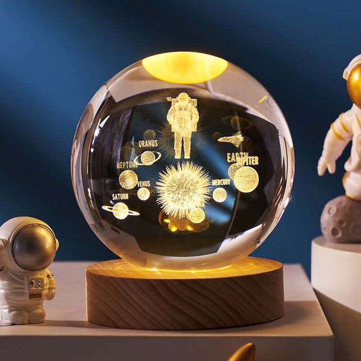 Luminous Starry Sky Crystal Ball Night Lamp with 3D planetary projection, featuring Saturn and astronaut design.