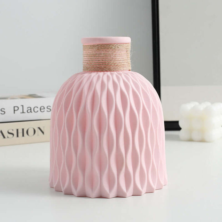 Creative pink decorative plastic vase with textured design, perfect for modern living rooms or event decor.