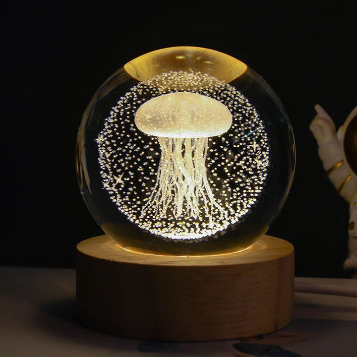 Luminous Starry Sky Crystal Ball Night Lamp with jellyfish design on wooden base.