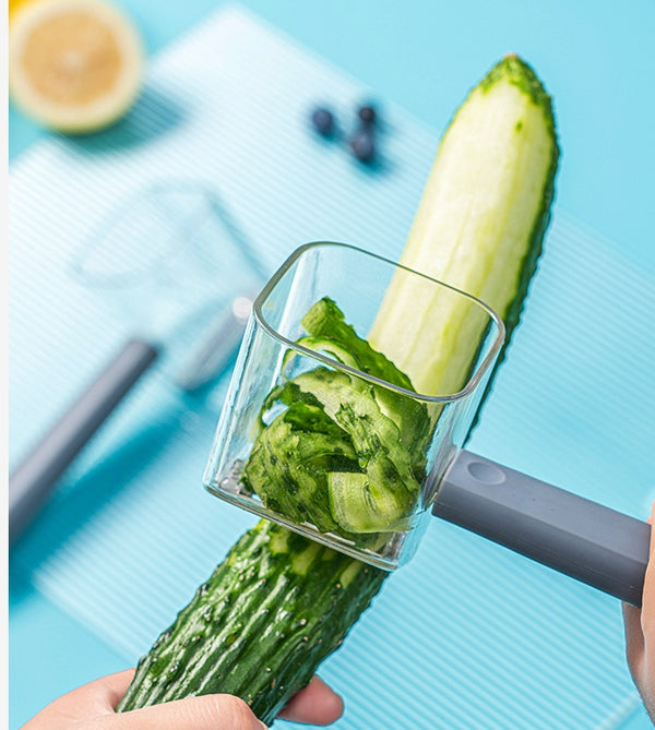 Stainless steel kitchen gadget peeling cucumber, versatile tool for slicing and grating in modern kitchen design, durable and multifunctional.