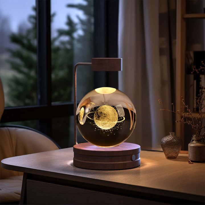 Crystal ball night light with 3D design on a wooden desk, showcasing biophilic and Japandi style, perfect for cozy and stylish decor.