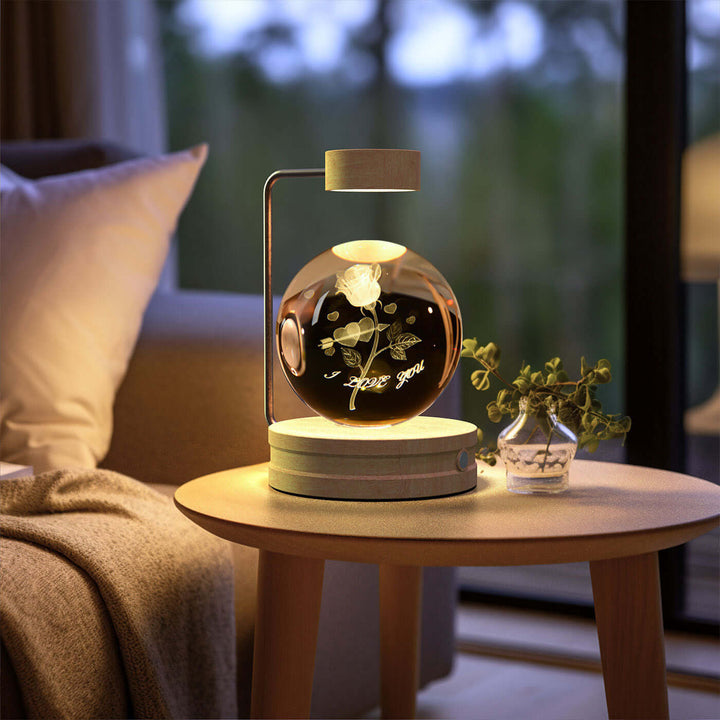 Crystal Ball Night Light on wooden table, USB-powered with 3D warm glow, perfect for biophilic design and cozy reading nooks.