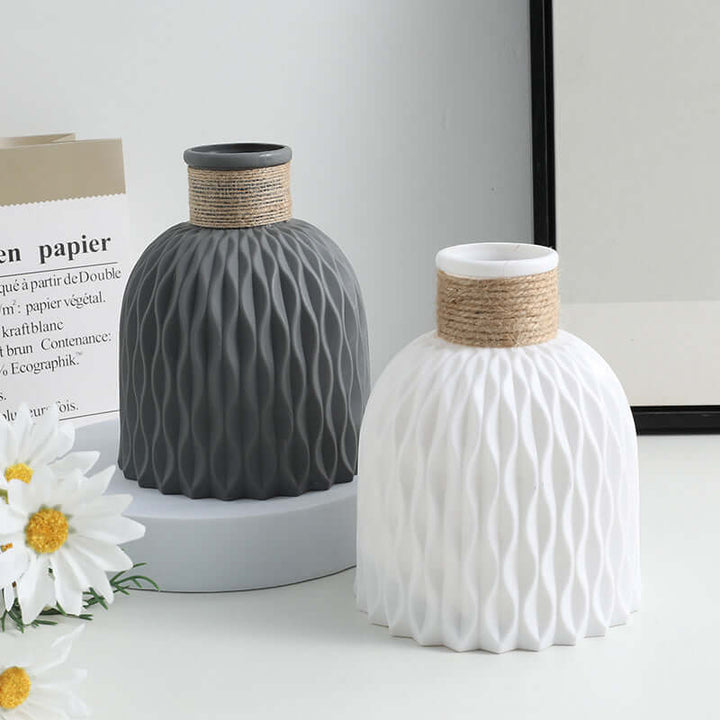 Creative decorative plastic vase in gray and white, modern design, perfect for home decor and events, featuring textured surface.