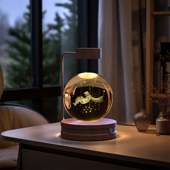 Crystal Ball Night Light on desk with 3D pattern, warm glow; perfect for Japandi style and cozy reading nooks. USB-powered LED lamp.