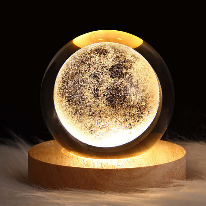 Luminous Starry Sky Crystal Ball Night Lamp with 3D Moon projection, biophilic design on a wooden base.