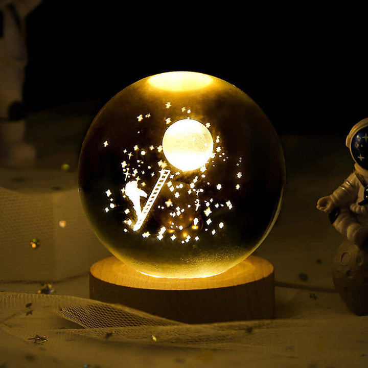 Luminous Starry Sky Crystal Ball Night Lamp with 3D Planetary Projection and cosmic design on a wooden base.