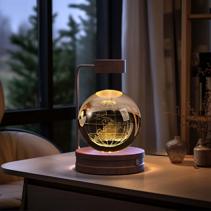 Crystal Ball Night Light on desk, featuring 3D design and warm LED glow for cozy interiors, ideal for bedrooms and living areas.