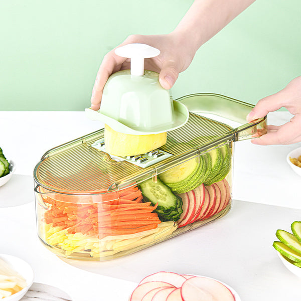 Multifunction transparent vegetable cutter slicing vegetables, showcasing versatility and biophilic design in kitchen tools.