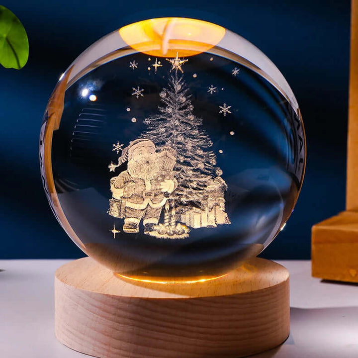 Christmas-themed crystal ball lamp with 3D Santa and tree projection on wooden base, perfect for holiday decor.