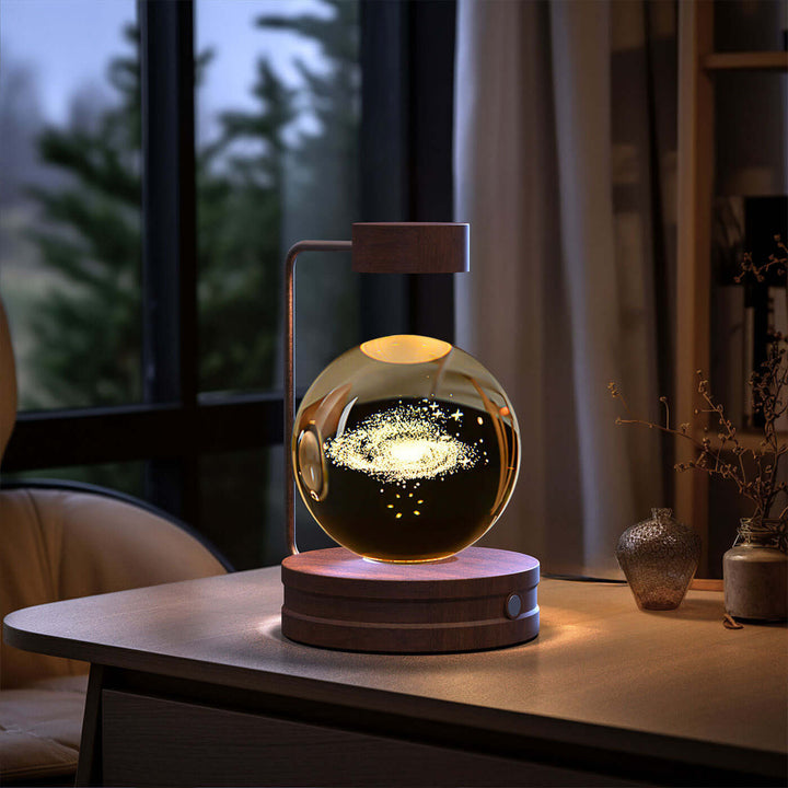 Crystal Ball Night Light on desk with warm LED glow, perfect for cozy bedtime ambiance, Japandi style, biophilic design.